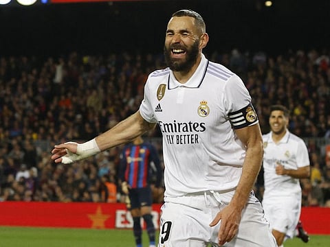 Real Madrid's Karim Benzema celebrates after scoring their fourth goal to complete his hat-trick against Barcelona on Wednesday.