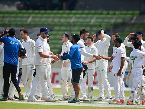 Bangladesh and Ireland players shake hands at the end of the fourth day of the Test match at the Sher-e-Bangla National Cricket Stadium in Dhaka.