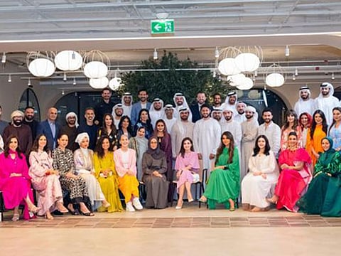 Participants of the Arab Social Media Influencers Ramadan Majlis’ organised by the Dubai Press Club stand for a group photo