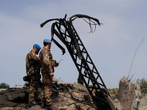 Italian UN peacekeeper soldiers inspect a small bridge that was destroyed by an Israeli airstrike, in Maaliya village, south Lebanon, on April 7, 2023.