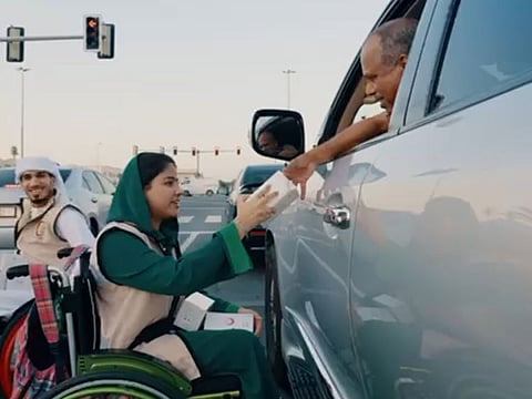 A still from the video showing people of determination gifting iftar boxes to motorists at a traffic light in Dubai