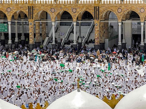 Worshippers pray at the Grand Mosque in Mecca during the second Friday prayers in the holy month of Ramadan on March 31, 2023.