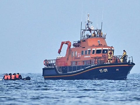 Crew aboard Royal National Lifeboat Institution (RNLI) Severn class lifeboat, the City of London II, pick up migrants in an inflatable boat who were travelling across the English Channel, bound for Dover on the south coast of England. - More than 45,000 migrants arrived in the UK last year by crossing the English Channel on small boats.