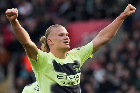 Manchester City's Erling Haaland celebrates after scoring his side's third goal during the English Premier League match against Southampton at St Mary's Stadium in Southampton, England.
