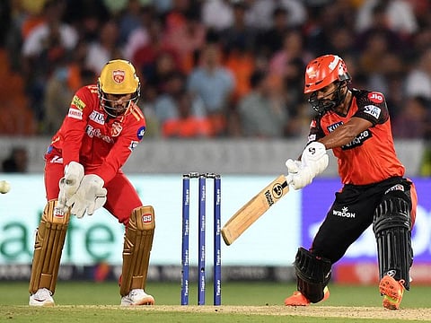 Sunrisers Hyderabad's Rahul Tripathi (R) plays a shot during the Indian Premier League (IPL) Twenty20 cricket match between Sunrisers Hyderabad and Punjab Kings at the Rajiv Gandhi International Cricket Stadium in Hyderabad on April 9, 2023.