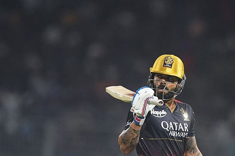 Royal Challengers Bangalore's Virat Kohli gestures as he walks back to the pavilion after his dismissal during the Indian Premier League match against Kolkata Knight Riders at the Eden Gardens Stadium in Kolkata.