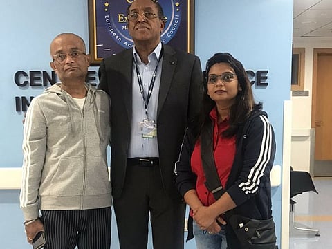 Santhosh (left) an Indian engineer, with his wife (right) and Dr. Fathelrahman Mohammed.