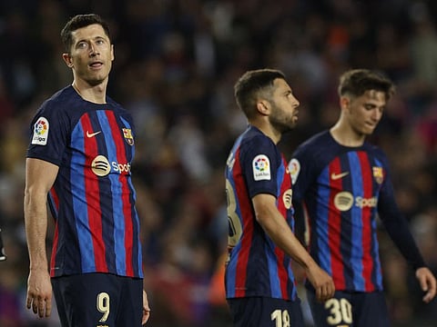 Barcelona's Robert Lewandowski looks dejected after the match.