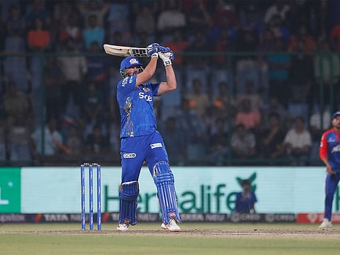 Rohit Sharma smashed 65 as Mumbai Indians edged out Delhi Capitals by six wickets in a last-ball IPL thriller to register their first win of the season on Tuesday.