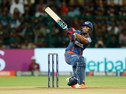 Nicholas Pooran of Lucknow Super Giants scores a six in the Tata Indian Premier League match against the Royal Challengers Bangalore at the M Chinnaswamy Stadium, Bengaluru, on April 9, 2023. His 15-ball fifty is the joint-second fastest in IPL history.