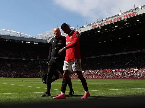 Manchester United's Marcus Rashford is helped off the pitch after sustaining a groin injury against Everton last weekend. He will miss the clash against Sevilla on Thursday.