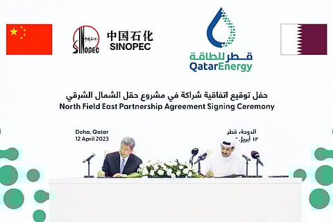 QatarEnergy CEO Saad al-Kaabi and Ma Yongsheng, Chairman of the Board of Sinopec sign during North Field East Partnership Agreement Signing Ceremony in Doha.