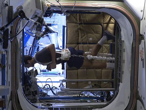 Still from video of Al Neyadi running 'horizontally' on treadmill inside the space station