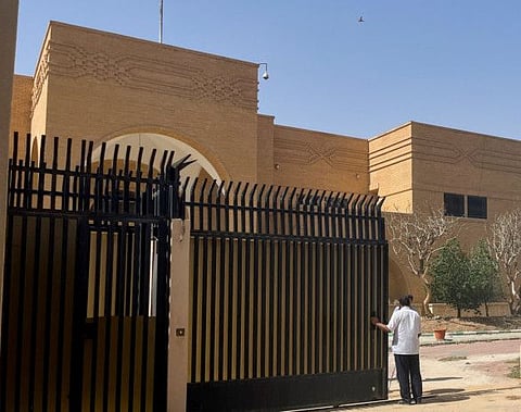 People stand outside the Iranian embassy in Riyadh which opened its gates on April 12, 2023.