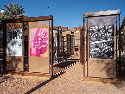The maze-like setting of the exhibition makes for a novel experience at the Hundred Best Arabic Posters exhibition in AlUla.