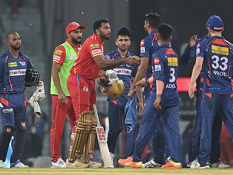 Punjab Kings' M Shahrukh Khan (3L) greets Lucknow Super Giants' players at the end of the Indian Premier League (IPL) Twenty20 cricket match between Lucknow Super Giants and Punjab Kings at the Ekana Cricket Stadium in Lucknow on April 15, 2023.