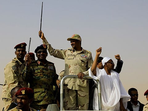 Lieutenant General Mohammad Hamdan Dagalo, deputy head of the military council and head of paramilitary Rapid Support Forces (RSF), greets his supporters as he arrives at a meeting in Aprag village, 60km from Khartoum, on June 22, 2019.