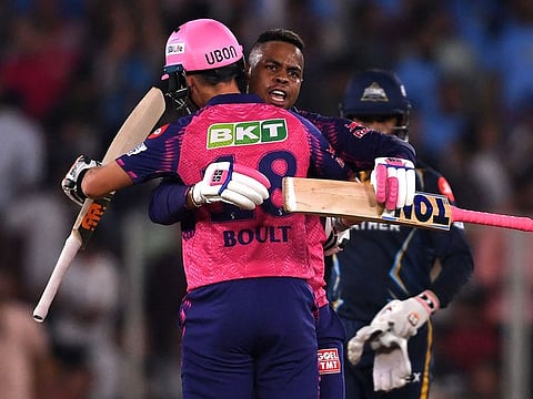 Rajasthan Royals' Shimron Hetmyer celebrates with Trent Boult after winning the Indian Premier League (IPL) Twenty20 cricket match between Gujarat Titans and Rajasthan Royals at the Narendra Modi Stadium in Ahmedabad.