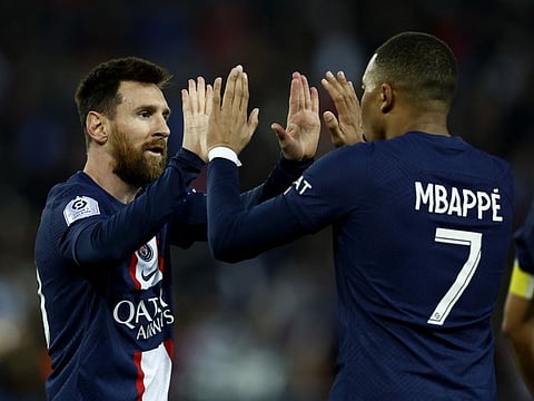 Paris St Germain's Lionel Messi (left) celebrates with Kylian Mbappe.