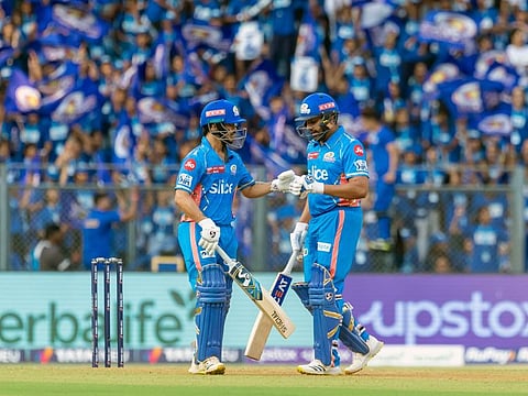 Mumbai Indians Rohit Sharma and Ishan Kishan fist bump each other during the match against Kolkata Knight Riders in Indian Premier League at Wankhede Stadium, in Mumbai.
