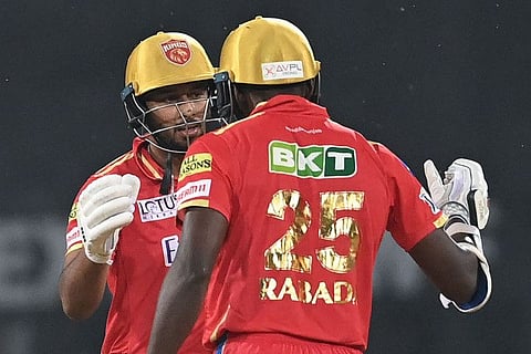 Punjab Kings' Shahrukh Khan (left) and Kagiso Rabada celebrate after winning the Indian Premier League match against Lucknow Super Giants at the Ekana Cricket Stadium in Lucknow.