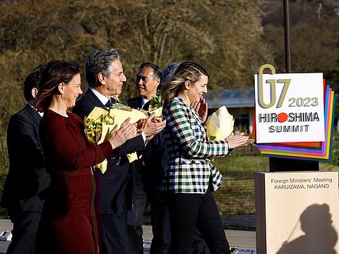 German foreign minister Annalena Baerbock, US Secretary of State Antony Blinken and Canadian foreign minister Melanie Joly applaud to students playing music in their welcoming event for G7 Foreign Ministers' meeting in Karuizawa, Japan, April 16, 2023.