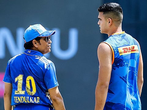 Former cricketer Sachin Tendulkar with his son Arjun Tendulkar ahead of the match between Mumbai Indians and Kolkata Knight Riders in Indian Premier League 2023, at Wankhede Stadium, in Mumbai on Sunday.