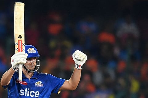Mumbai Indians' Cameron Green celebrates after scoring a half-century against Sunrisers Hyderabad in Hyderabad on Tuesday.
