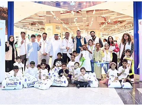 The children with the volunteers after shopping at Oasis Mall in Dubai