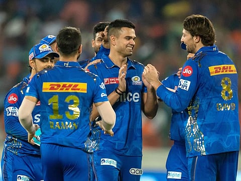 Arjun Tendulkar of the Mumbai Indians celebrates after claiming the wicket of Bhuvneshwar Kumar of the Sunrisers Hyderabad in the Tata Indian Premier League match at the Rajiv Gandhi International Stadium, Hyderabad, April 18, 2023. That was his maiden wicket in IPL.