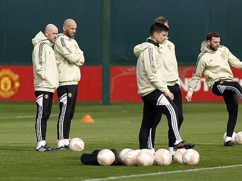 Manchester United manager Erik Ten Hag with his coaching staff during training at the Aon Training Complex, Carrington, Britain ahead of their Europa League clash against Sevilla.