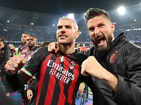 AC Milan defender Theo Hernandez (left) and forward Olivier Giroud celebrate at the end of the UEFA Champions League quarter-finals second leg match against Napoli at the Diego-Maradona stadium in Naples.