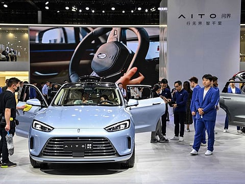 Huawei’s sleek Aito EV turns heads at the auto show, blending smart tech and luxury design in a bold statement about the future of electric mobility.
