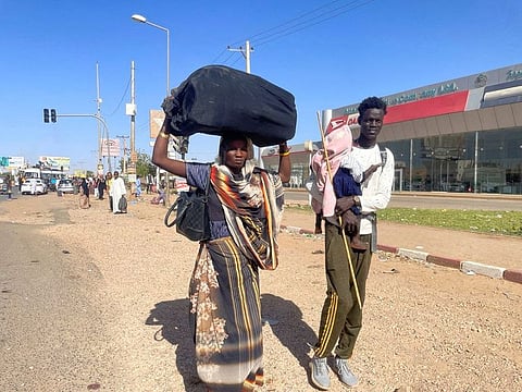 People fleeing Khartoum amid clashes between the paramilitary Rapid Support Forces and the army in Khartoum.