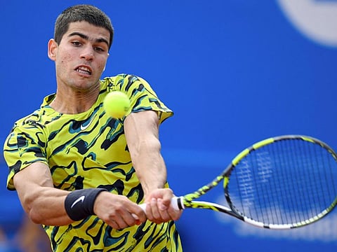 Spain's Carlos Alcaraz returns the ball to Spain's Alejandro Davidovich during his victory in the Barcelona Open quarterfinals on Friday.