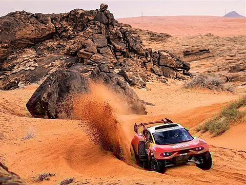 Sebastien Loeb and Fabian Lurquin leading the title race in their Bahrain Raid Xtreme Prodrive Hunter.