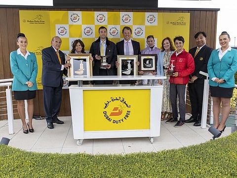 Grand Alliance’s owner and breeder Susan Roy, son Mickey Roy, trainer Charlie Fellowes, jockey James Doyle and groom Mikkel Motterson with Colm McLoughlin, Sinead El Sibai and Noel Parial of Dubai Duty Free at the presentation ceremony.