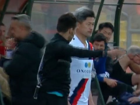 Former Japan striker Kazuyoshi Miura about to enter as a substitute in the 90th minute.