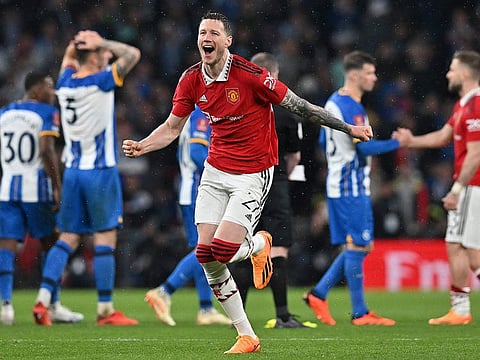 Manchester United's Dutch striker Wout Weghorst celebrates after Manchester United won a penalty shoot out during the English FA Cup semi-final football match between Manchester United and Brighton and Hove Albion at Wembley Stadium in north west London on April 23, 2023.