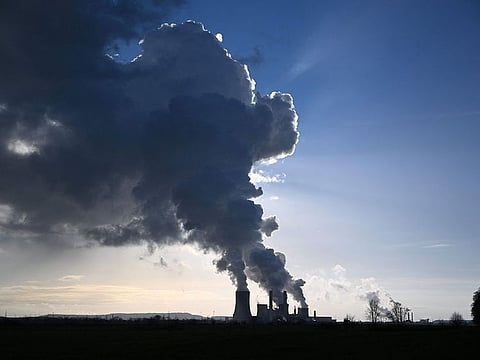 Huge clouds of steam come out of the chimneys of coal power plant in Niederaussem, western Germany.