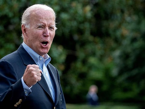US President Joe Biden answers a shouted question from a reporter while walking to Marine One on the South Lawn of the White House in Washington, DC, on August 7, 2022, as he travels to Rehoboth Beach, Delaware.