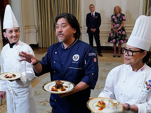 Guest Chef Edward Lee, centre, flanked by White House Executive Pastry Chef Susie Morrison, left, and White House Executive Chef Cris Comerford, right, talks about the menu during a preview, Monday, April 24, 2023, for Wednesday's State Dinner with South Korea's President Yoon Suk Yeol at the White House in Washington.
