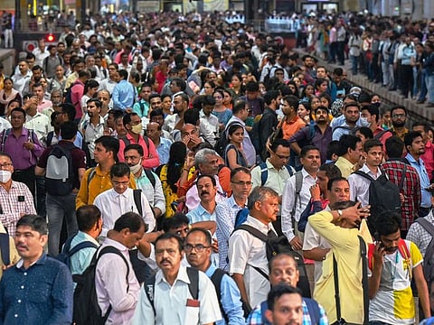 People wait for train at the Chhatrapati Shivaji Terminus railway station in Mumbai on April 19, 2023. India is set to overtake China as the world's most populous country by the end of June, UN estimates showed.
