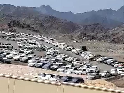 Vehicles being swept away during flooding in Nizwa.