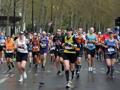 Participants near the finish of the 2023 London Marathon in central London on April 23, 2023. While consistent physical training should be enough to allow anyone to run a marathon, running such a distance as 26.2 miles (42.195 kilometres) requires more than physical stamina.