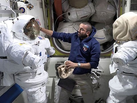 Still from clip of Al Neyadi explaining aspects of the spacesuit onboard the International Space Station.