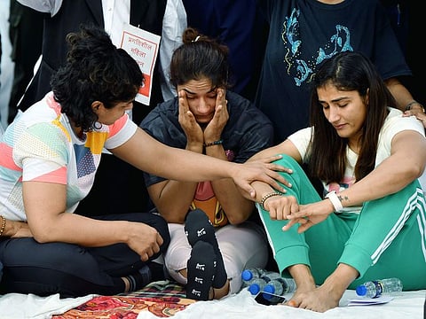 Indian wrestlers Vinesh Phogat, Sangeeta Phogat and Sakshi Malik during a protest against the Wrestling Federation of India chief Brij Bhushan Singh over allegations of sexual harassment and intimidation, at Jantar Mantar in New Delhi on April 26, 2023.