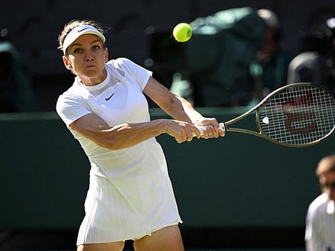 Romania's Simona Halep in action during her semifinal match against Kazakhstan's Elena Rybakina during the 2022 Wimbledon championships.