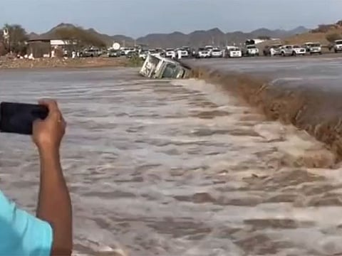A vehicle skids and falls into an overflowing wadi in Asir region.