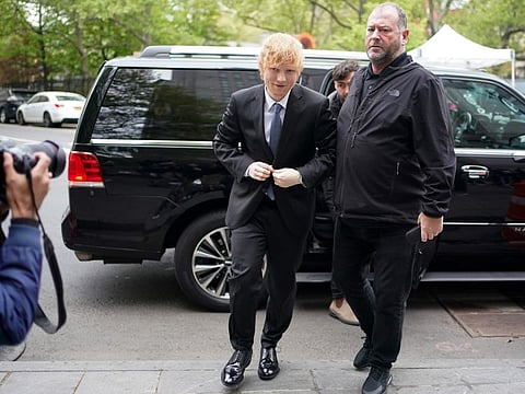 Ed Sheeran, left, arrives at federal court in New York on April 27, 2023.